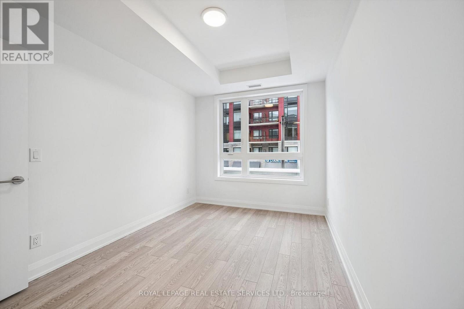 Primary Bedroom with Wide Plank Laminate Flooring - 223 - 3250 Carding Mill Trail, Oakville, ON - Indoor Photo Showing Other Room