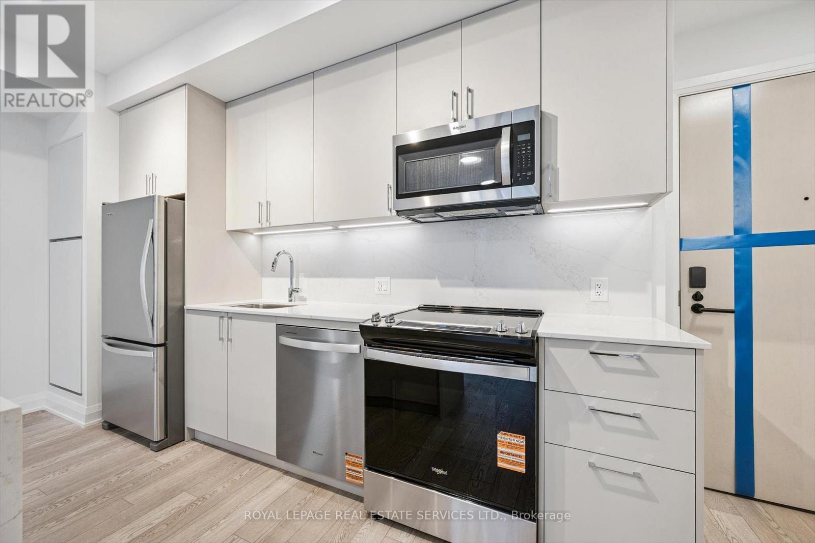 Contemporary Kitchen is both Functional & Elegant - 223 - 3250 Carding Mill Trail, Oakville, ON - Indoor Photo Showing Kitchen With Stainless Steel Kitchen