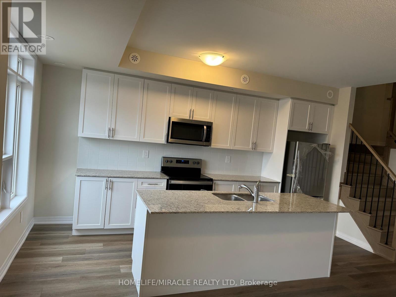 416 - 1577 Rose Way, Milton, ON - Indoor Photo Showing Kitchen With Double Sink