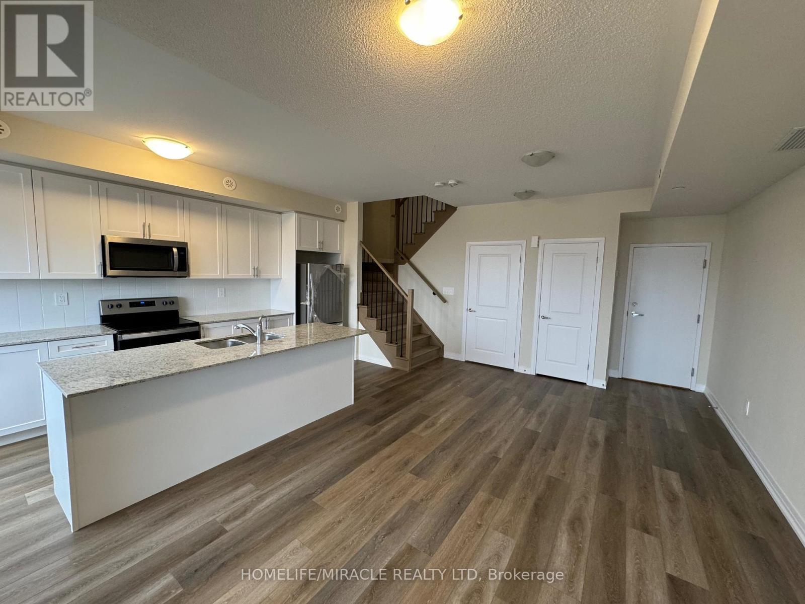 416 - 1577 Rose Way, Milton, ON - Indoor Photo Showing Kitchen With Double Sink