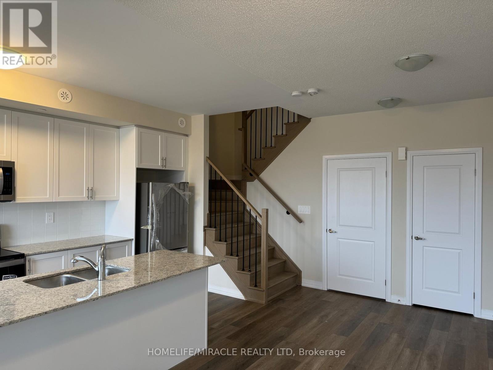 416 - 1577 Rose Way, Milton, ON - Indoor Photo Showing Kitchen With Double Sink