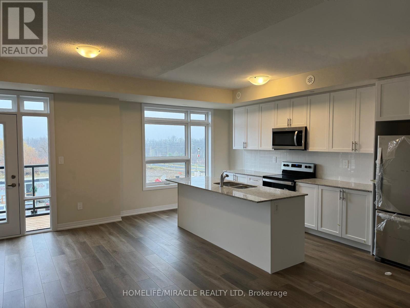416 - 1577 Rose Way, Milton, ON - Indoor Photo Showing Kitchen With Stainless Steel Kitchen With Double Sink