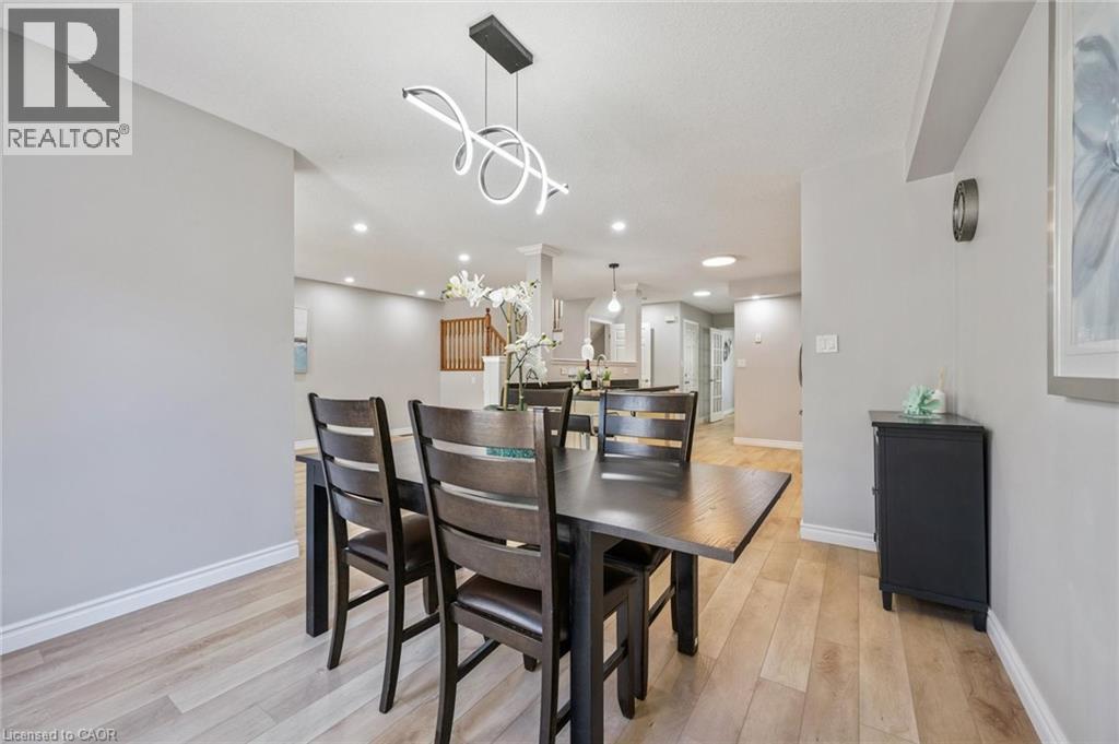 Dining area with light wood finished floors and recessed lighting - 723 Black Cherry Street, Waterloo, ON - Indoor Photo Showing Dining Room