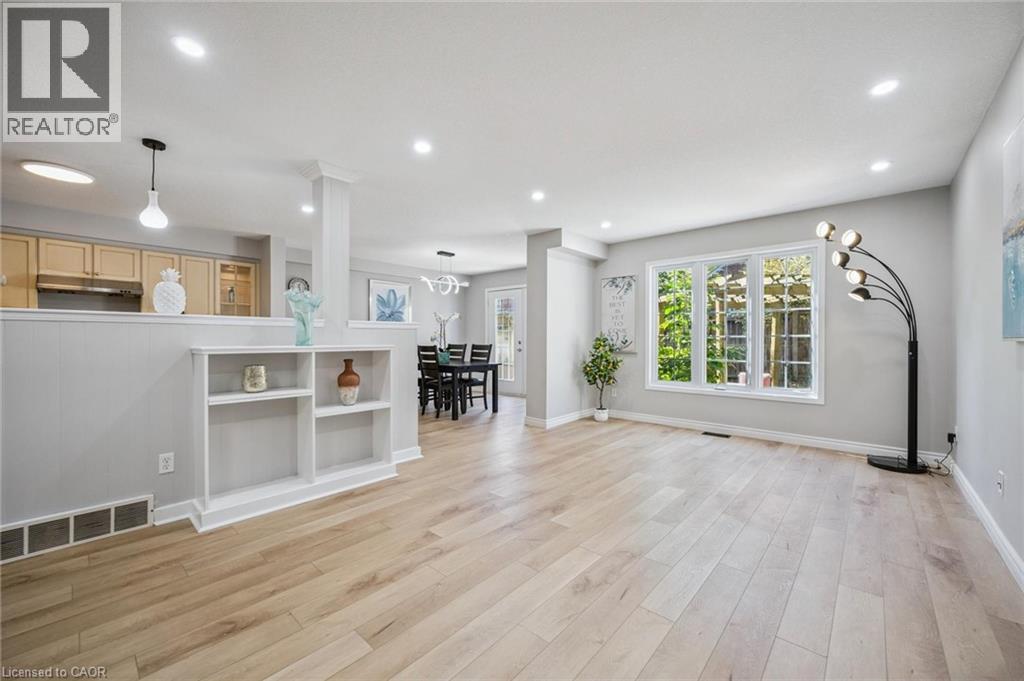 Unfurnished living room featuring recessed lighting and light wood-style floors - 723 Black Cherry Street, Waterloo, ON - Indoor
