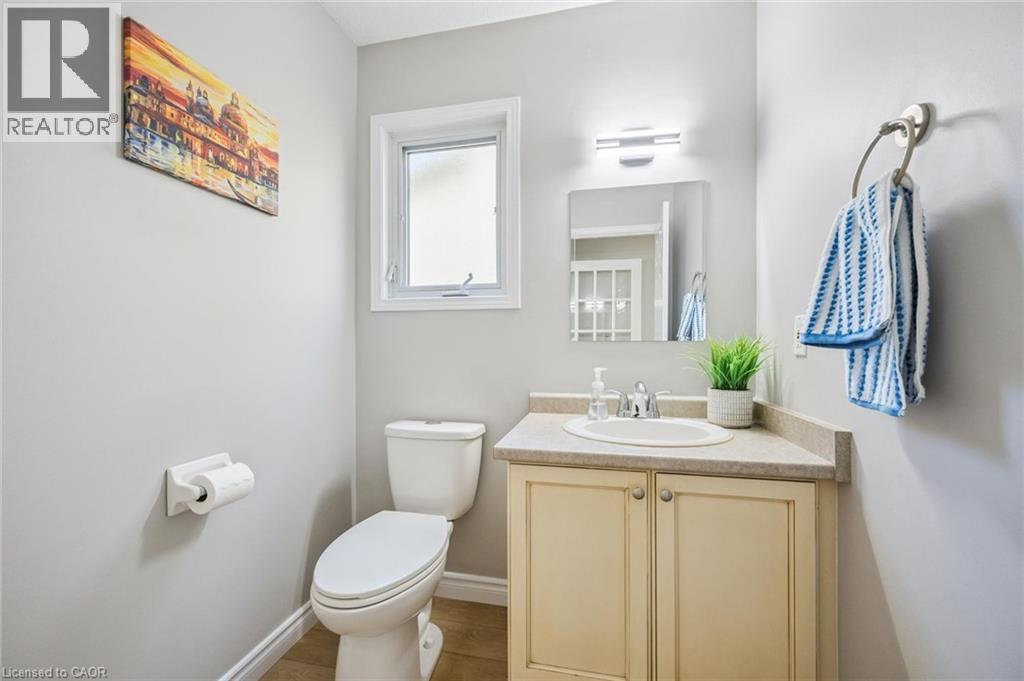 Bathroom with vanity and wood finished floors - 723 Black Cherry Street, Waterloo, ON - Indoor Photo Showing Bathroom