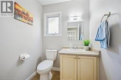 Bathroom with vanity and wood finished floors -