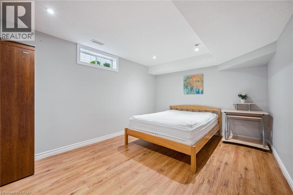 Bedroom featuring light wood-type flooring and recessed lighting - 723 Black Cherry Street, Waterloo, ON - Indoor Photo Showing Bedroom