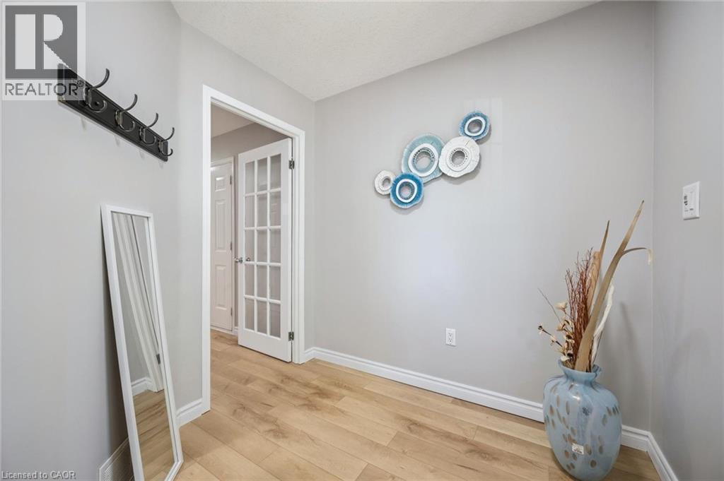 Hall featuring light wood-style floors and baseboards - 723 Black Cherry Street, Waterloo, ON - Indoor Photo Showing Other Room