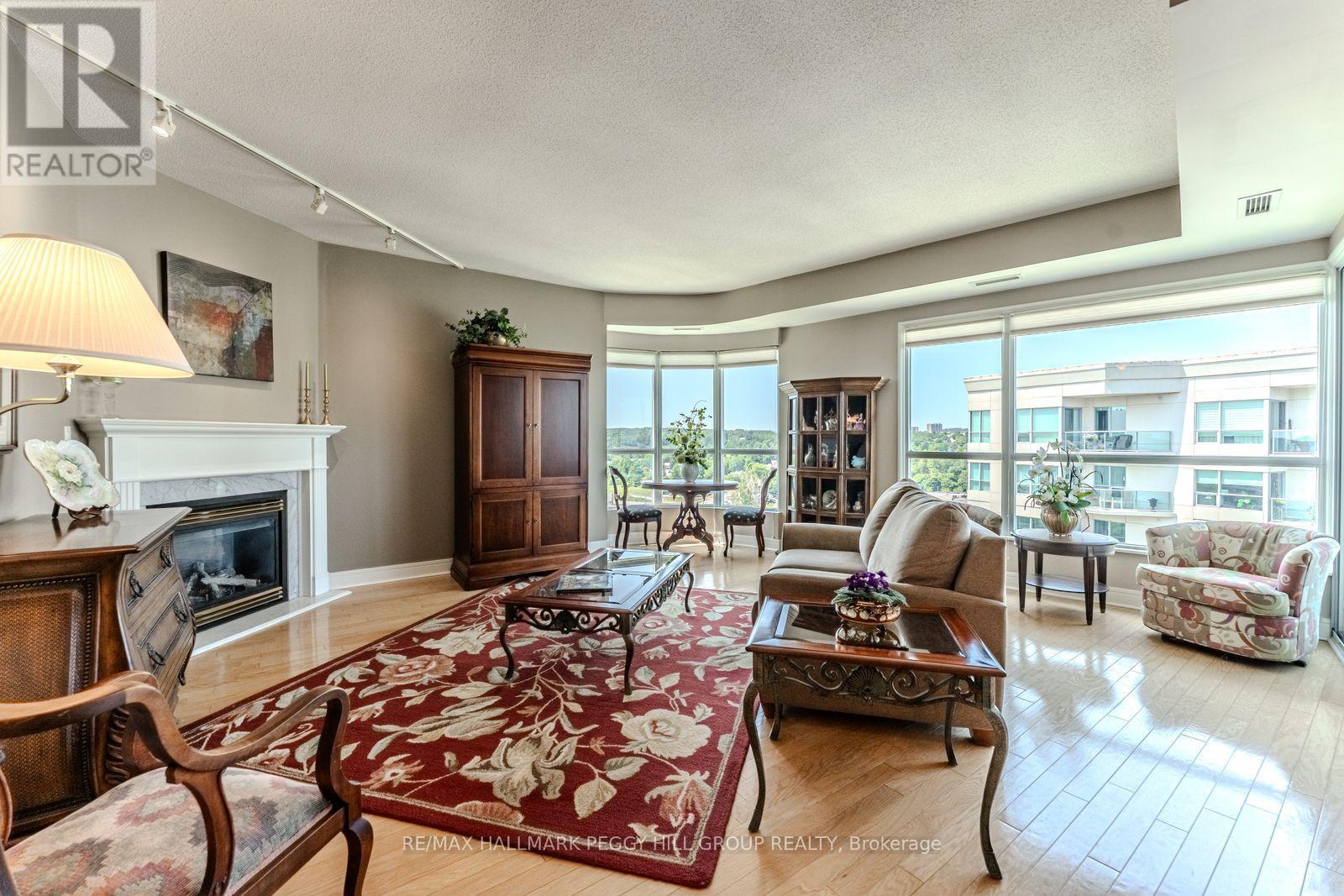 Ph2/3 - 2 Toronto Street, Barrie, ON - Indoor Photo Showing Living Room With Fireplace