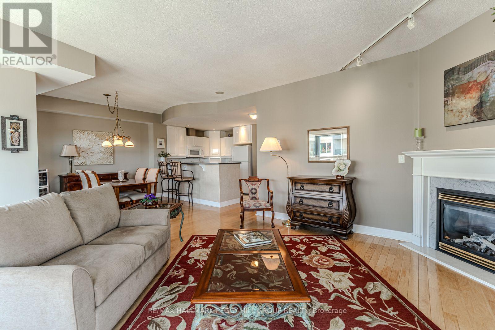 Ph2/3 - 2 Toronto Street, Barrie, ON - Indoor Photo Showing Living Room With Fireplace