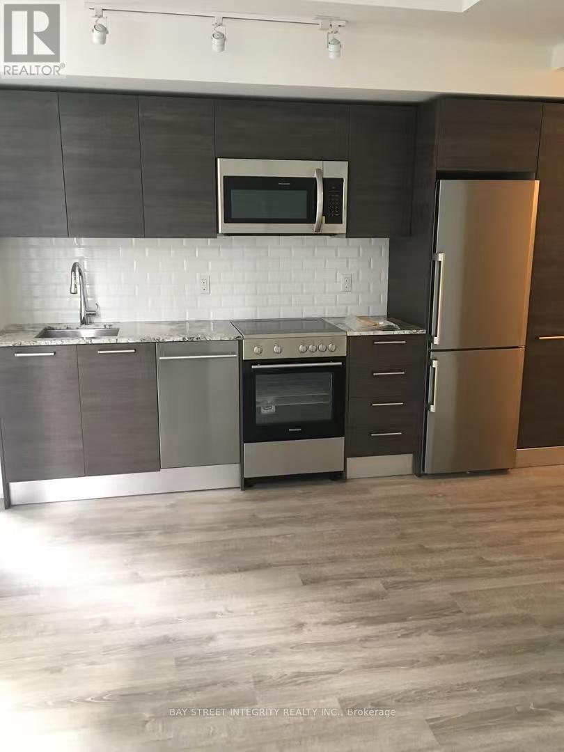 710 - 28 Wellesley Street E, Toronto, ON - Indoor Photo Showing Kitchen With Upgraded Kitchen