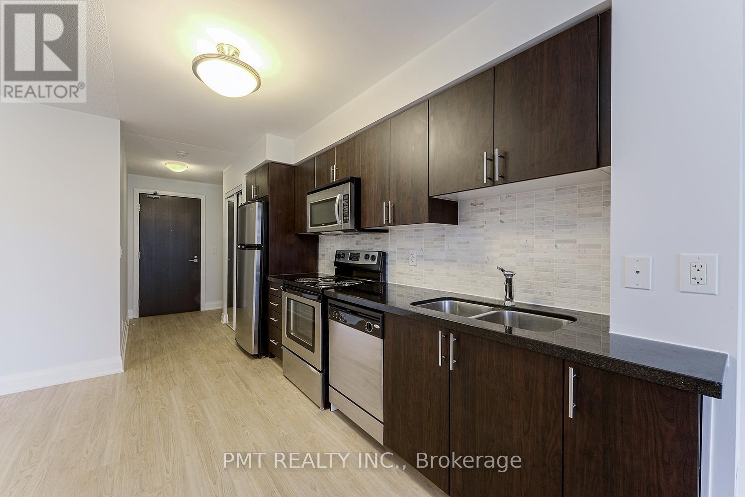 319 - 1 De Boers Drive, Toronto, ON - Indoor Photo Showing Kitchen With Stainless Steel Kitchen With Double Sink