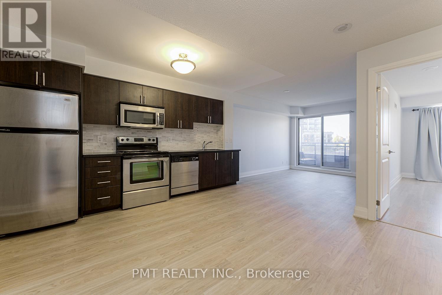 319 - 1 De Boers Drive, Toronto, ON - Indoor Photo Showing Kitchen With Stainless Steel Kitchen