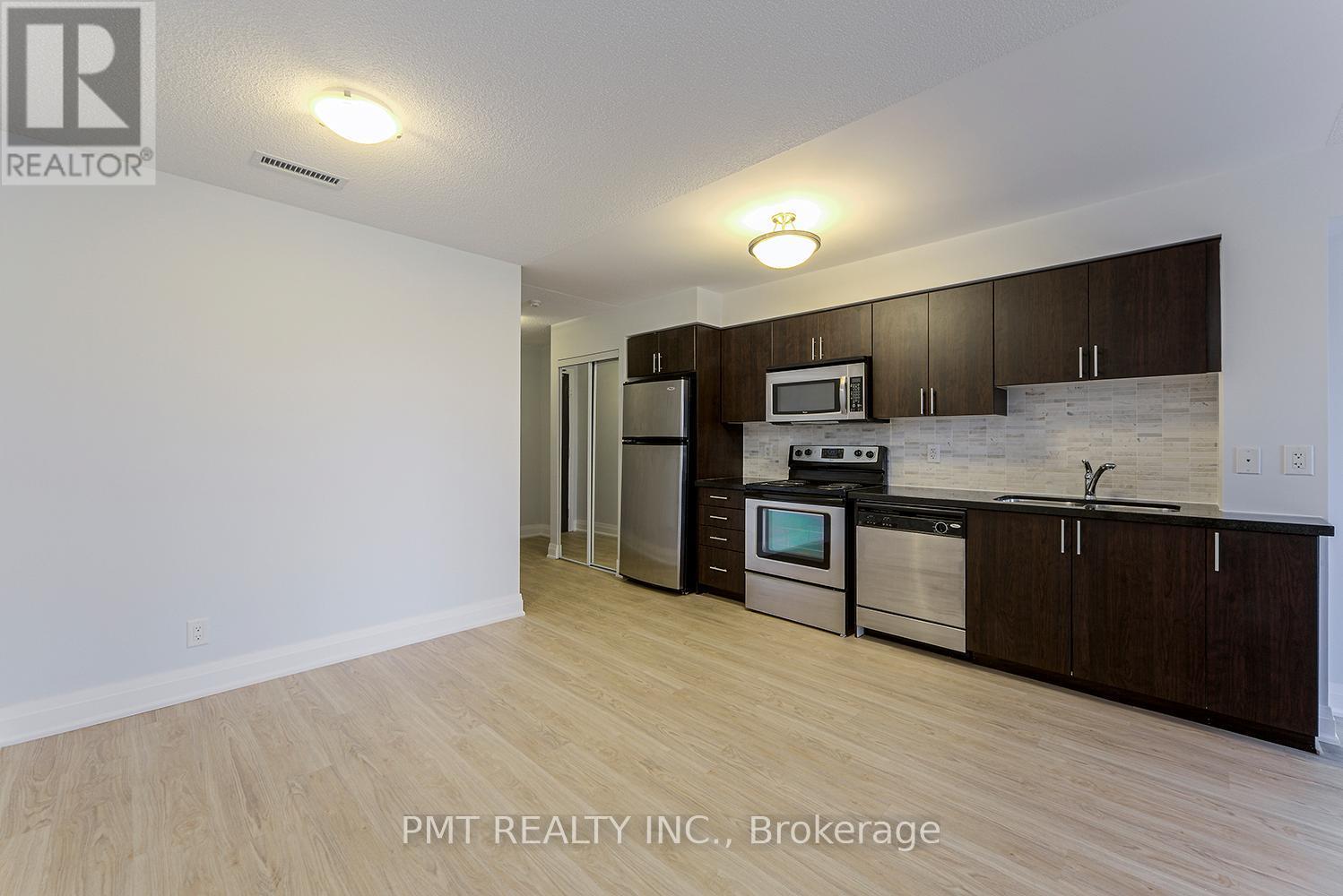 319 - 1 De Boers Drive, Toronto, ON - Indoor Photo Showing Kitchen With Stainless Steel Kitchen