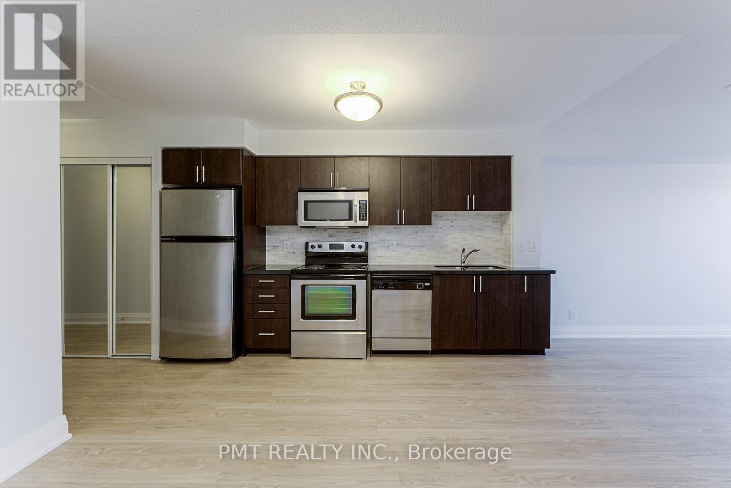 319 - 1 De Boers Drive, Toronto, ON - Indoor Photo Showing Kitchen With Stainless Steel Kitchen