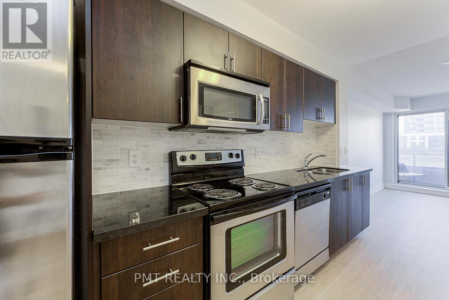 319 - 1 De Boers Drive, Toronto, ON - Indoor Photo Showing Kitchen With Stainless Steel Kitchen With Double Sink With Upgraded Kitchen