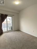 Unfurnished room with carpet flooring and baseboards -