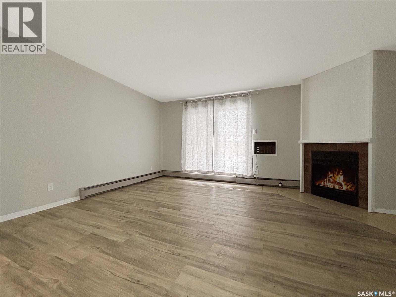 B03 245 Kingsmere Boulevard, Saskatoon, SK - Indoor With Fireplace