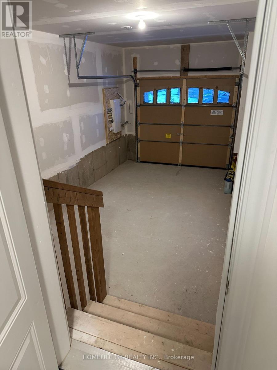 8 - 68 First Street, Orangeville, ON - Indoor Photo Showing Garage