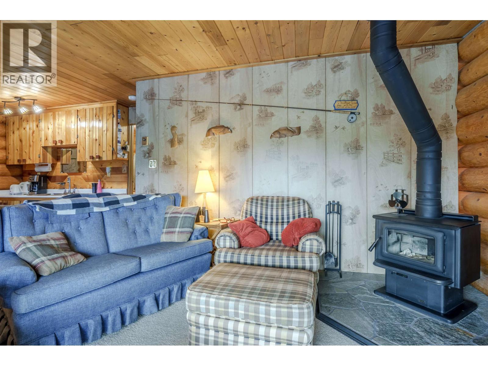 7561 Mccarthy Road, Bridge Lake, BC - Indoor Photo Showing Living Room With Fireplace