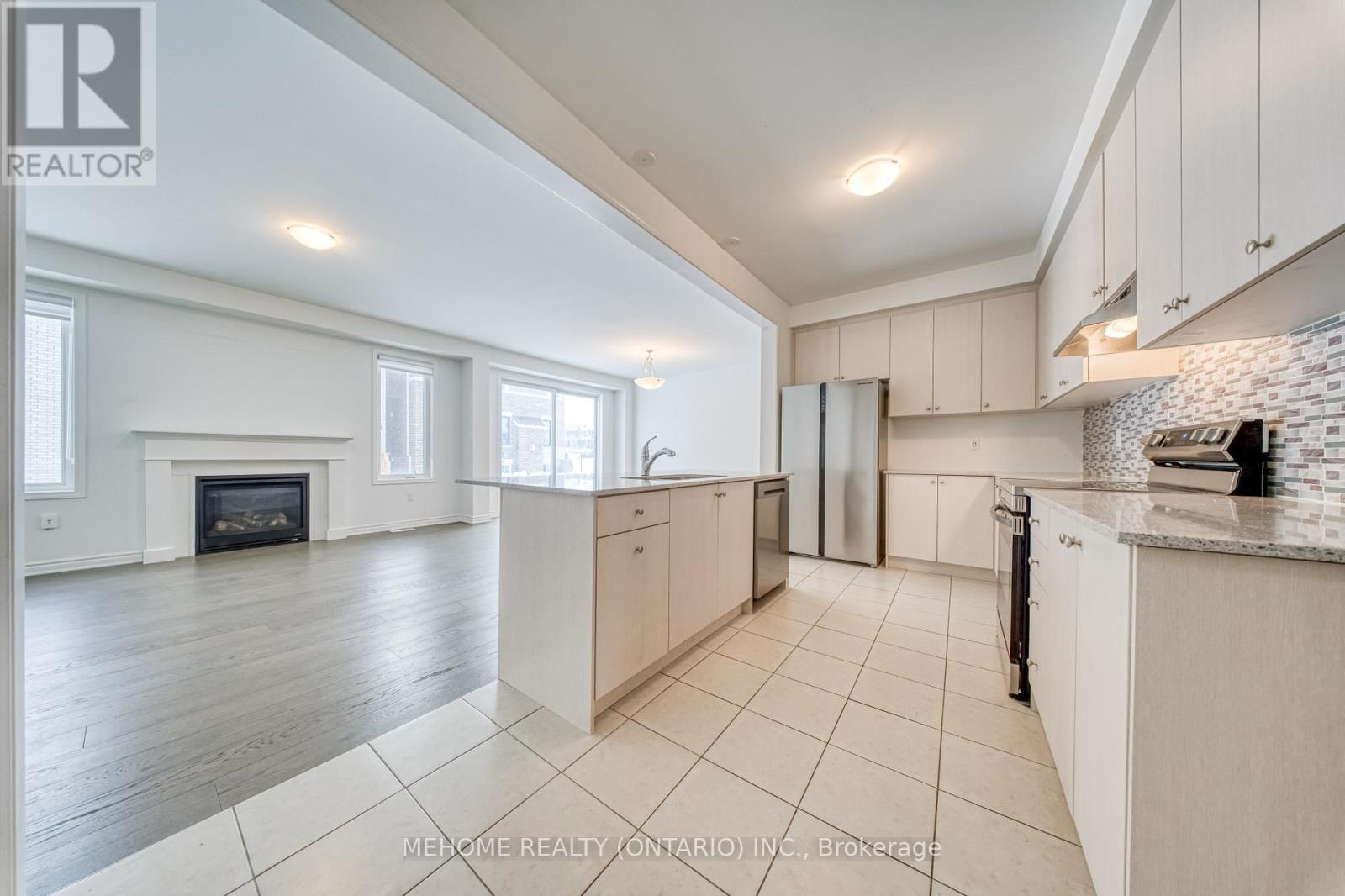 1851 Passionfruit Grove, Pickering, ON - Indoor Photo Showing Kitchen With Fireplace