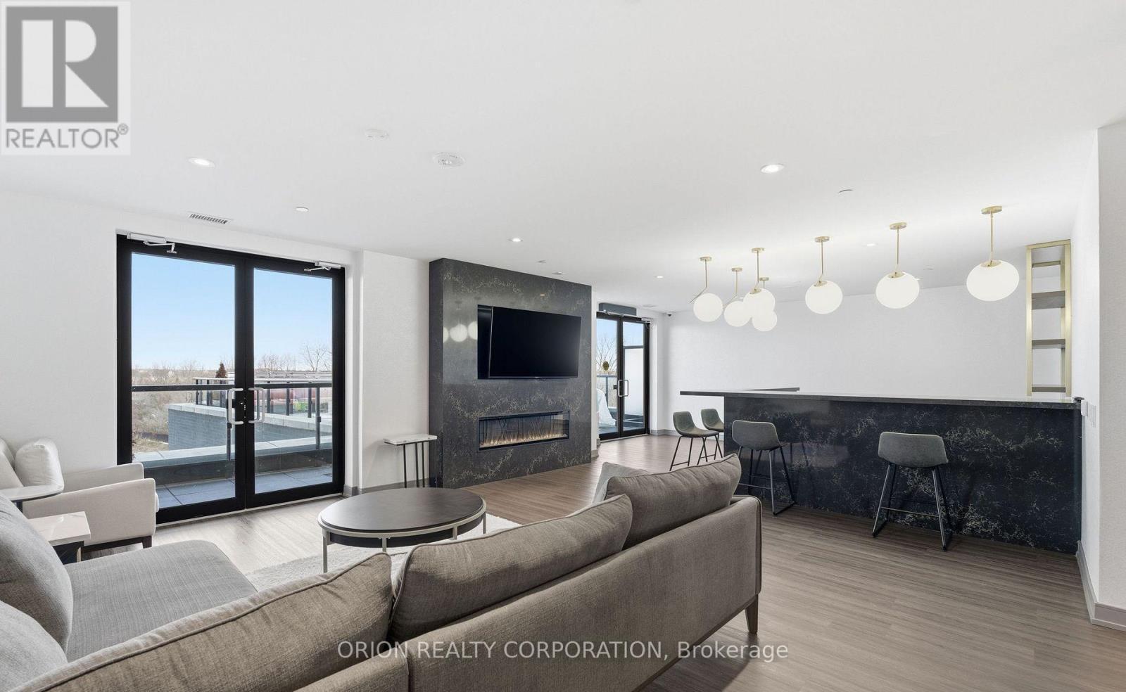 903 - 8020 Derry Road, Milton, ON - Indoor Photo Showing Living Room With Fireplace