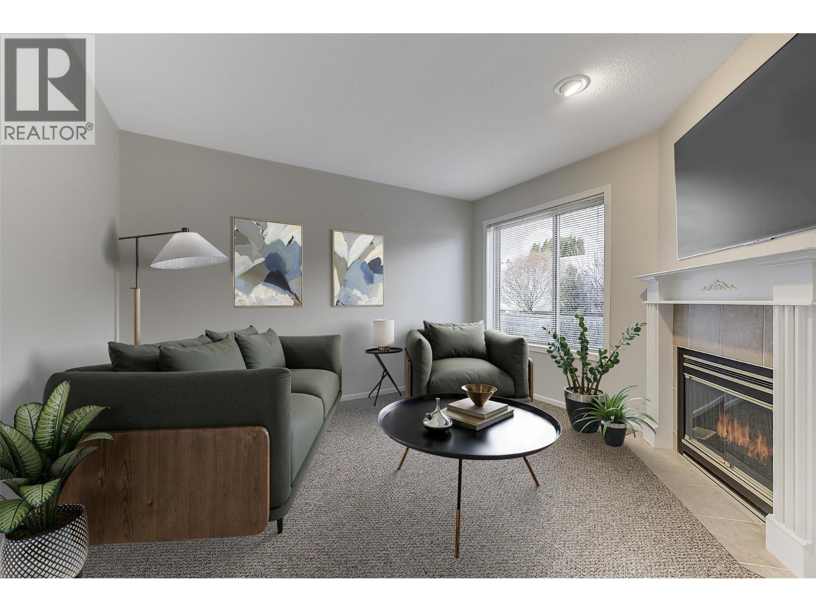 Virtually Staged Family Room - 2330 Butt Road Unit# 458, West Kelowna, BC - Indoor Photo Showing Living Room With Fireplace
