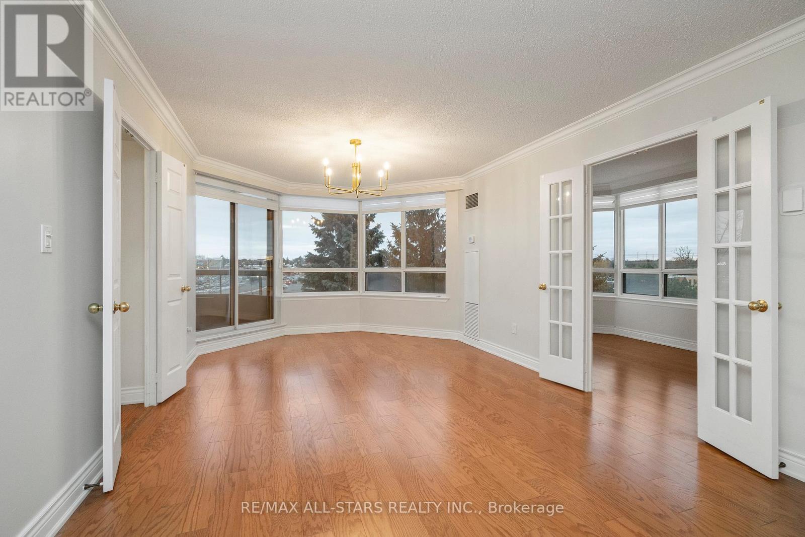 Large dining area with walk out to balcony - 404 - 610 Bullock Drive, Markham, ON - Indoor