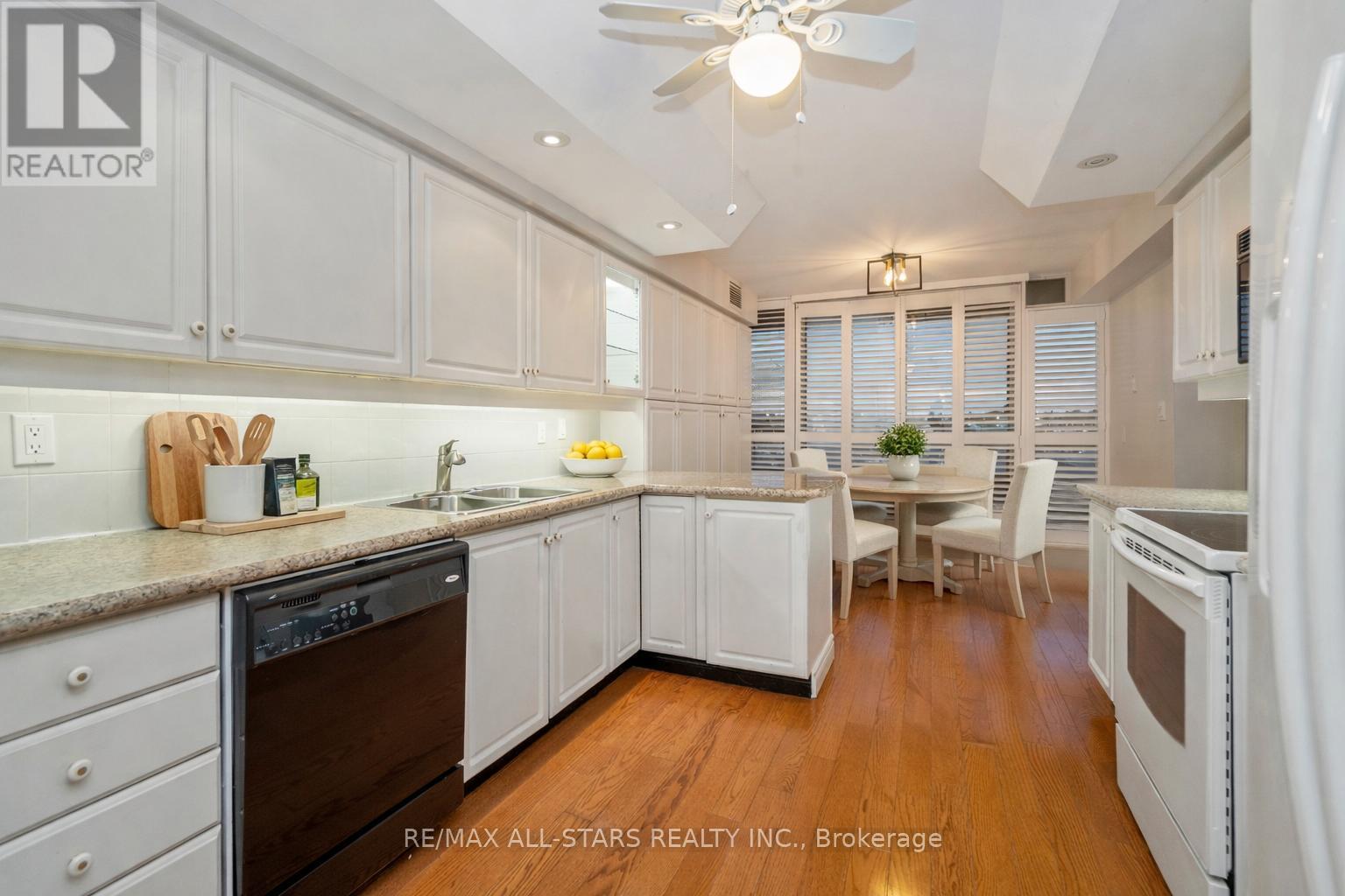 Virtually staged kitchen - 404 - 610 Bullock Drive, Markham, ON - Indoor Photo Showing Kitchen With Double Sink