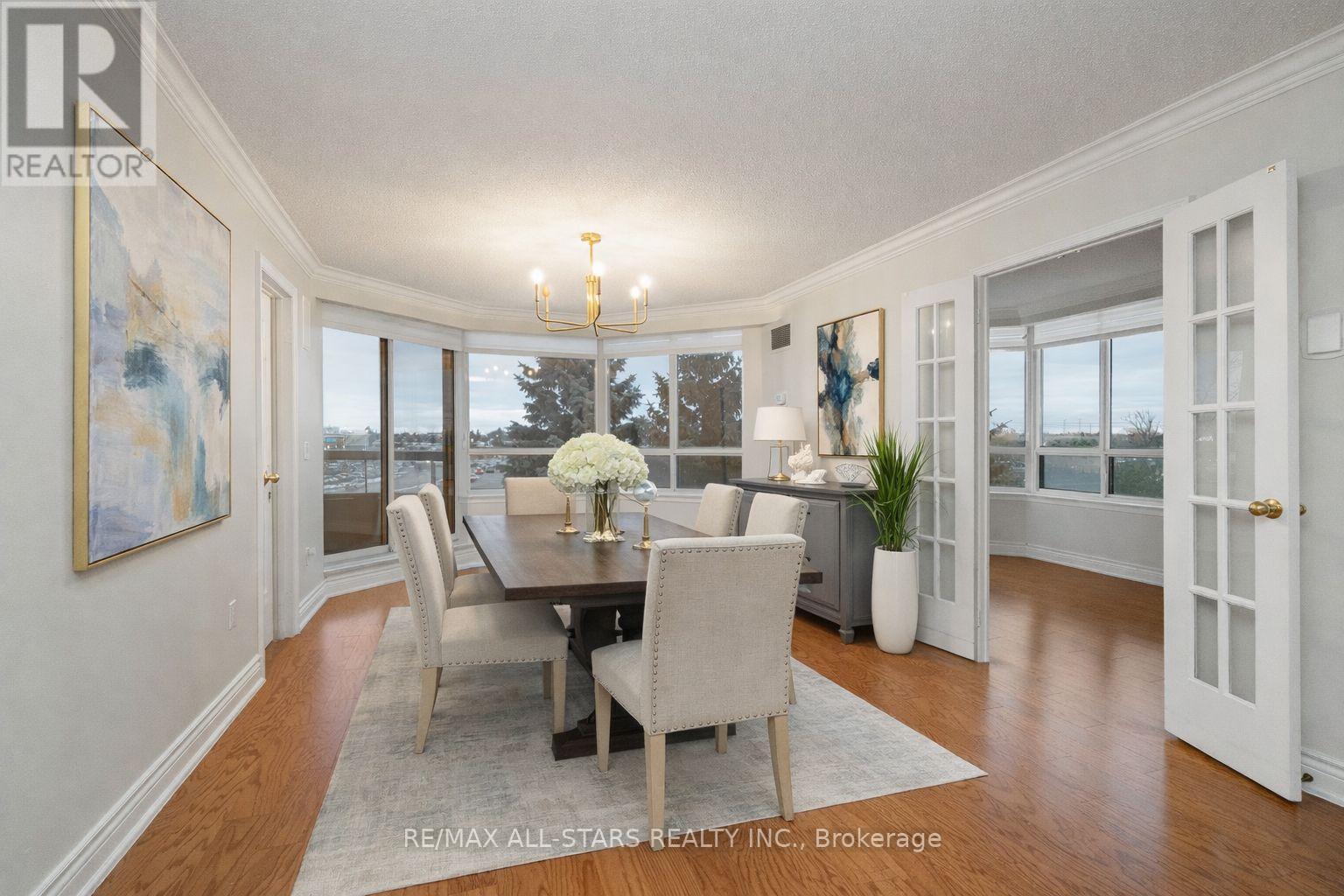 Virtually staged dining rm - 404 - 610 Bullock Drive, Markham, ON - Indoor Photo Showing Dining Room