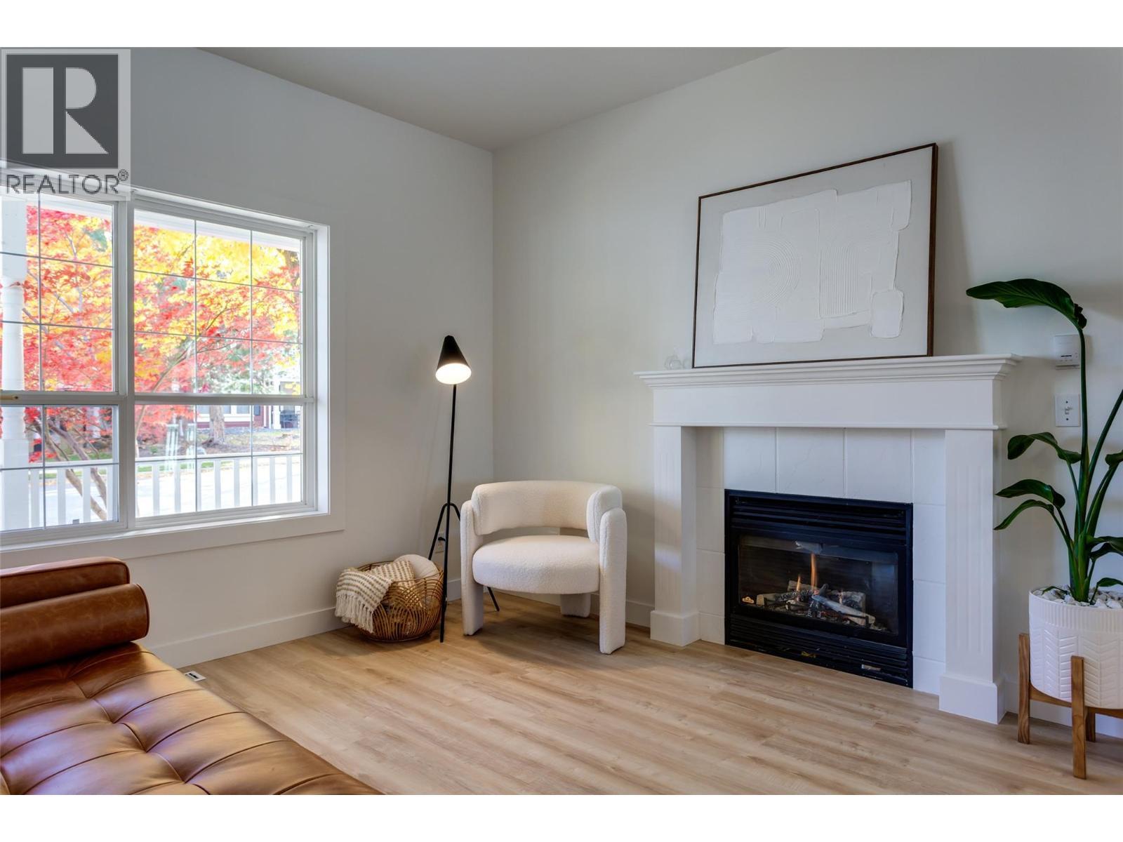 Cozy gas fireplace - 388 Mccarren Avenue, Kelowna, BC - Indoor Photo Showing Living Room With Fireplace