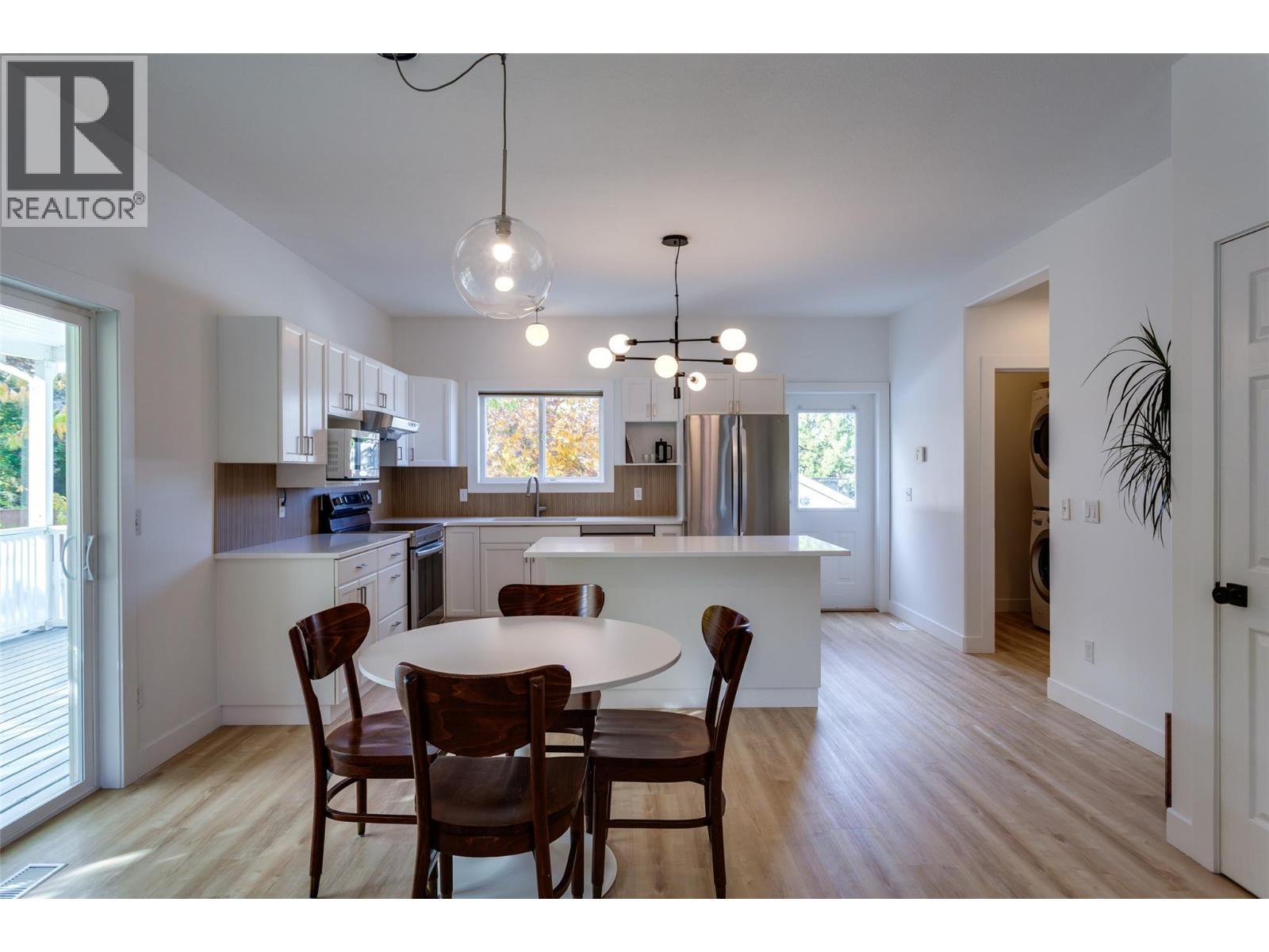 Main home kitchen and dining area - 388 Mccarren Avenue, Kelowna, BC - Indoor Photo Showing Dining Room