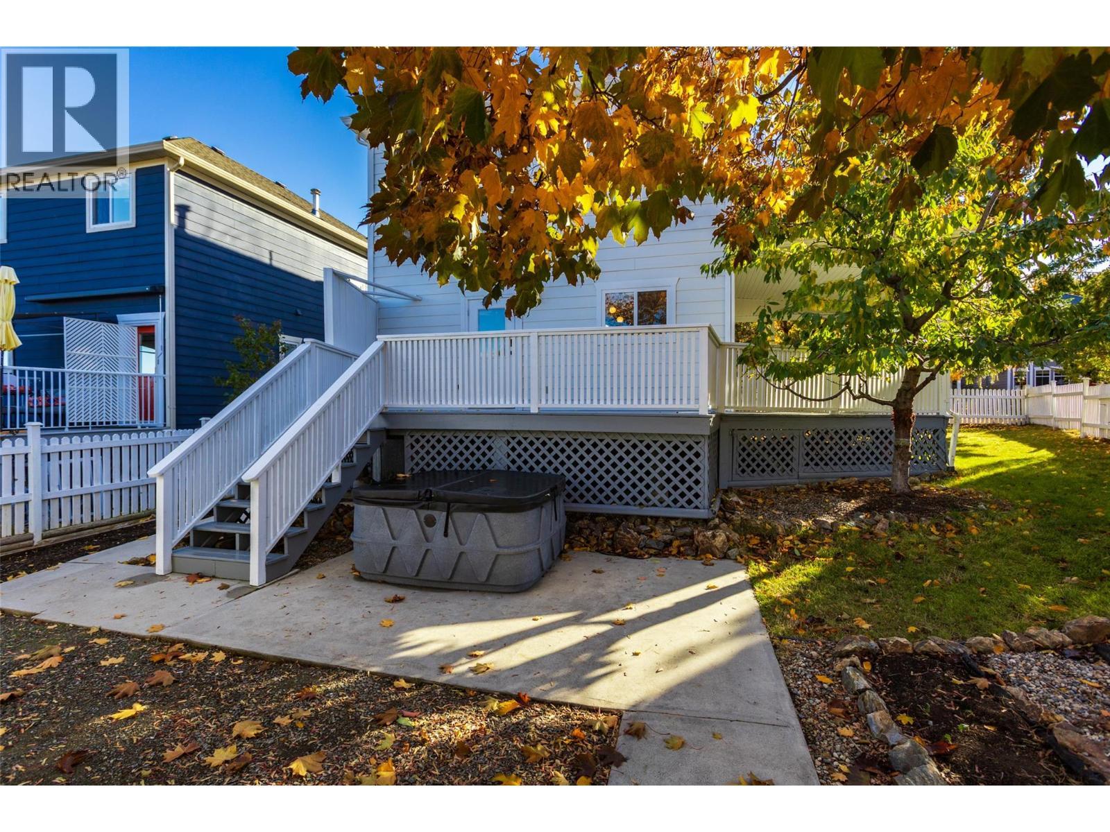 Rear yard with hot tub - 388 Mccarren Avenue, Kelowna, BC - Outdoor With Deck Patio Veranda