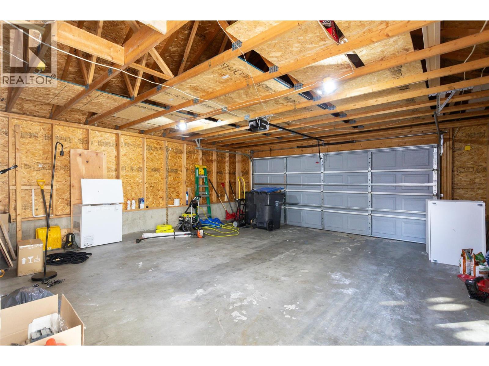 two car detached garage - 388 Mccarren Avenue, Kelowna, BC - Indoor Photo Showing Garage
