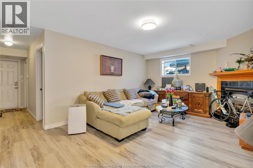 4316 Golfcourse Crescent, Windsor, ON - Indoor Photo Showing Living Room With Fireplace