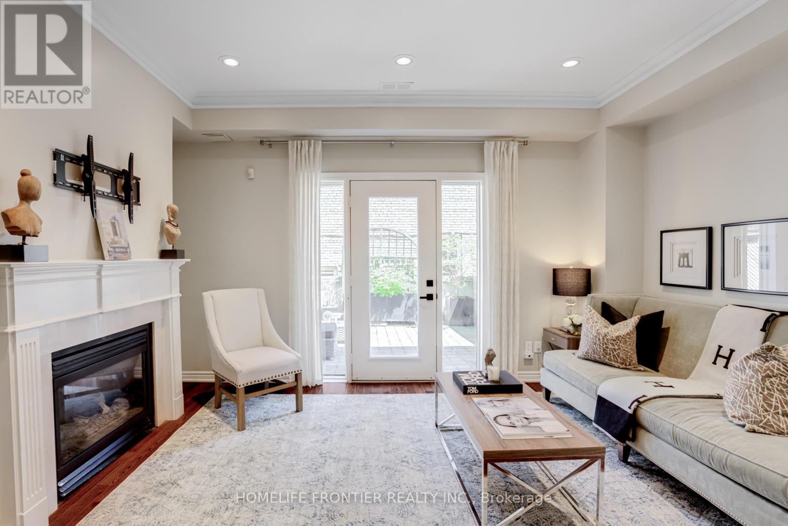 4 - 22 Balmoral Avenue, Toronto, ON - Indoor Photo Showing Living Room With Fireplace