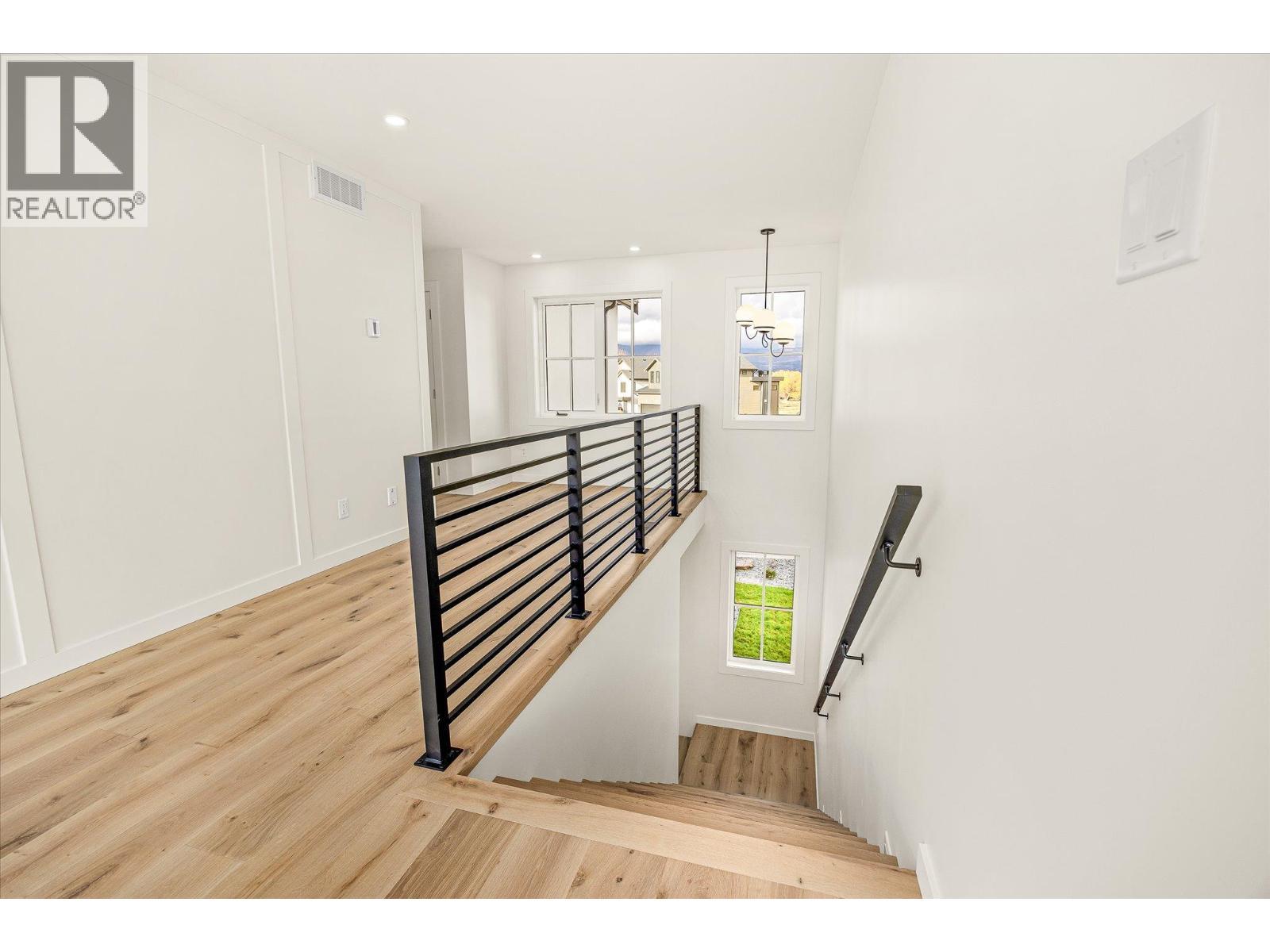 stairs up - 980 Bull Crescent, Kelowna, BC - Indoor Photo Showing Other Room