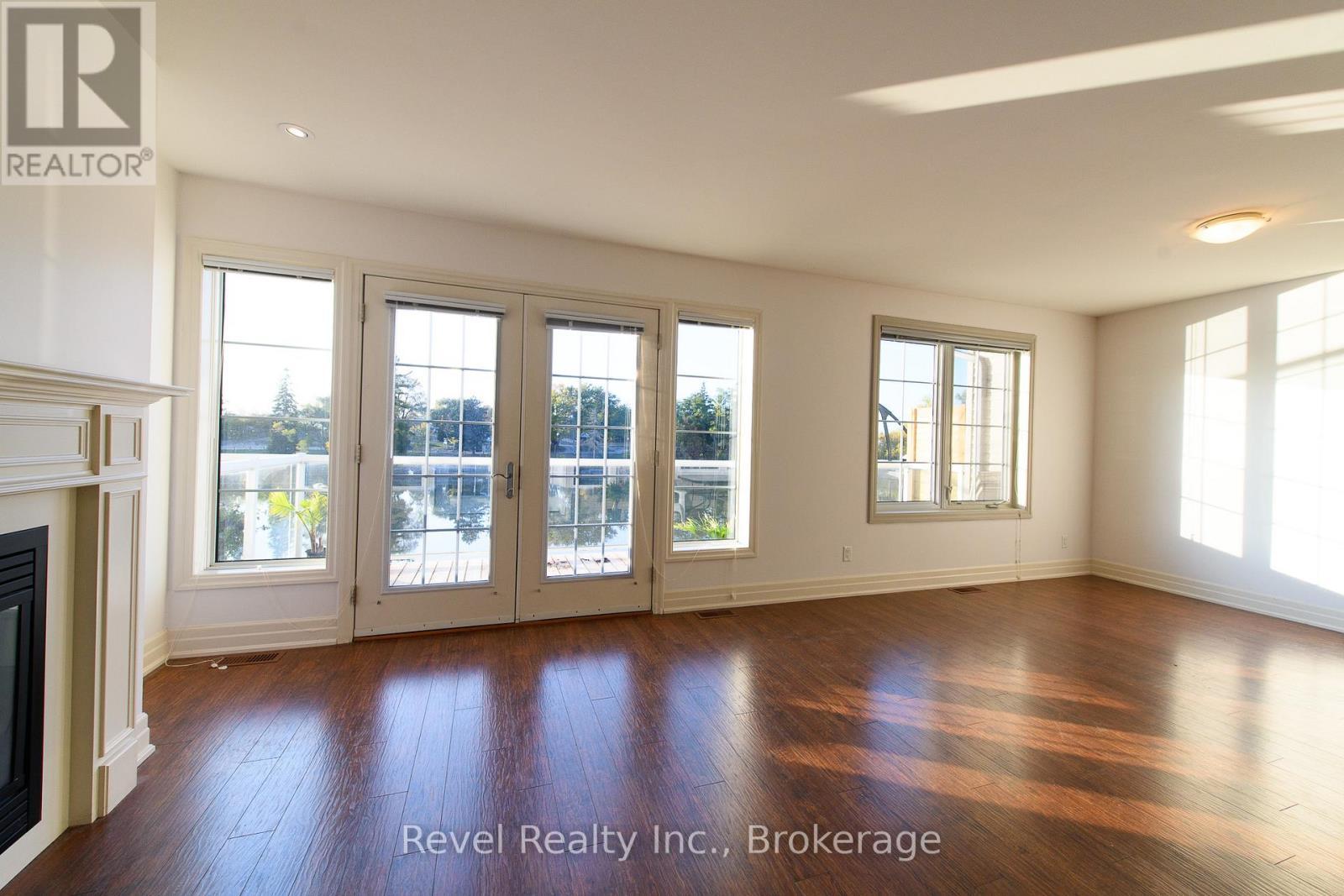 4 - 64 River Road E, Wasaga Beach, ON - Indoor Photo Showing Other Room With Fireplace