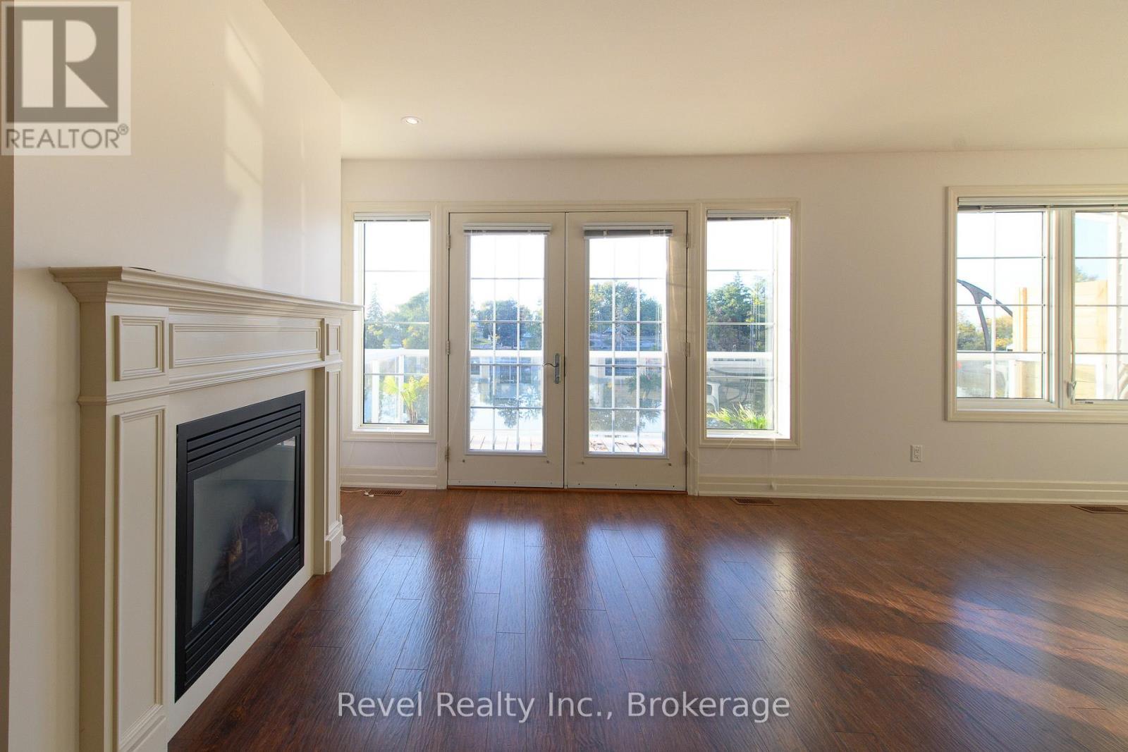 4 - 64 River Road E, Wasaga Beach, ON - Indoor With Fireplace