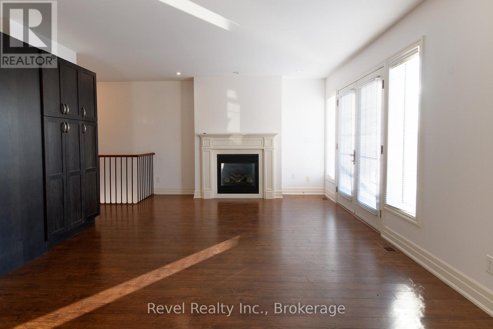 4 - 64 River Road E, Wasaga Beach, ON - Indoor Photo Showing Living Room With Fireplace