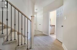 facing fron entrance, powder room right -