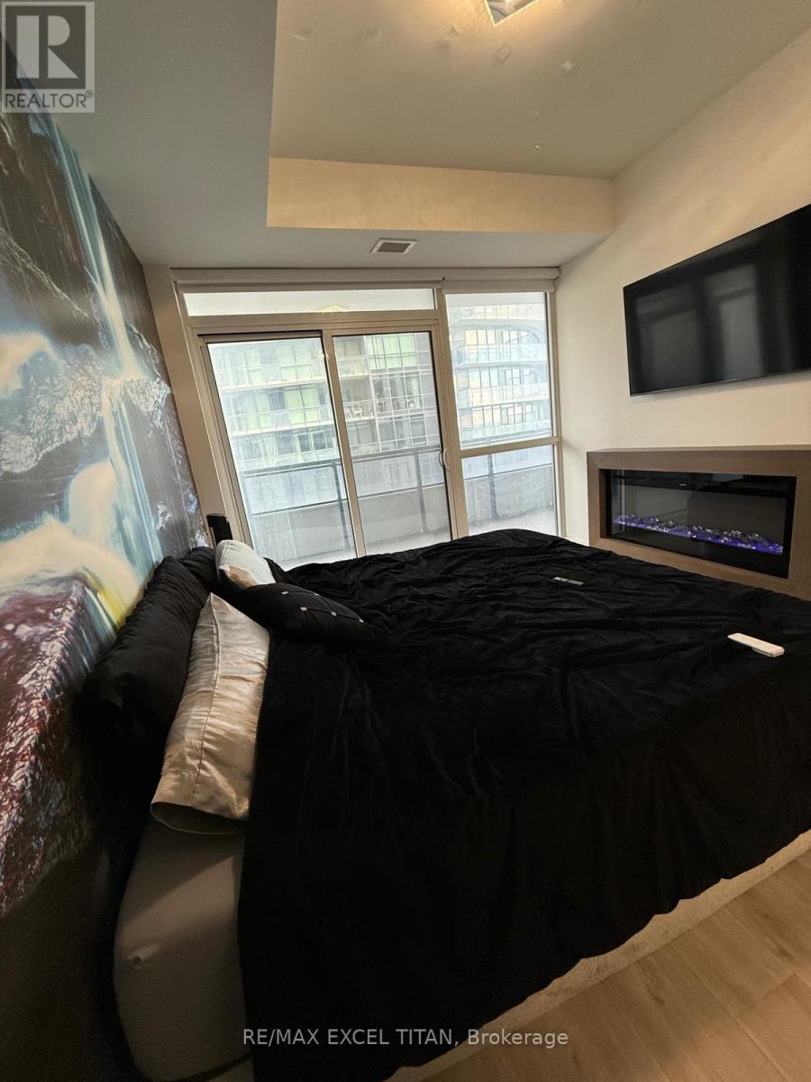 906 - 65 Annie Craig Drive, Toronto, ON - Indoor With Fireplace