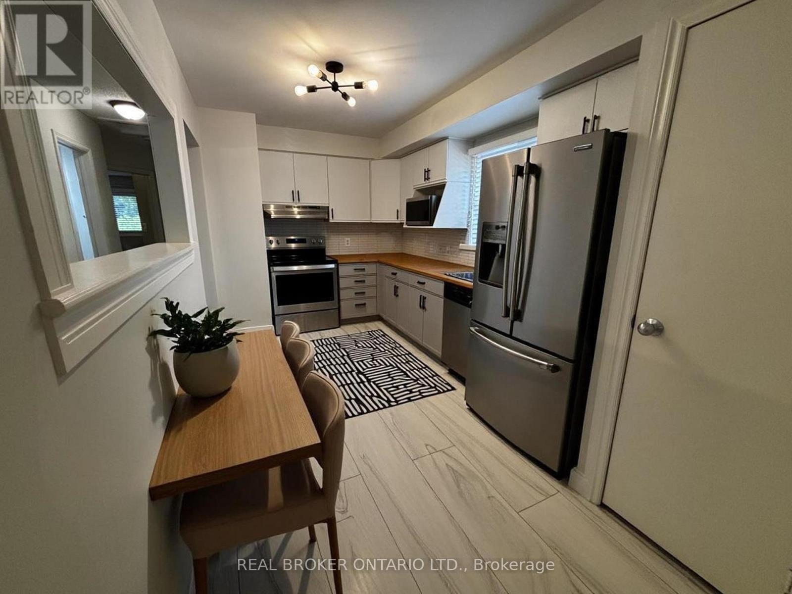 Photo Virtually Staged - Upper - 102 Bonaventure Drive, London East, ON - Indoor Photo Showing Kitchen