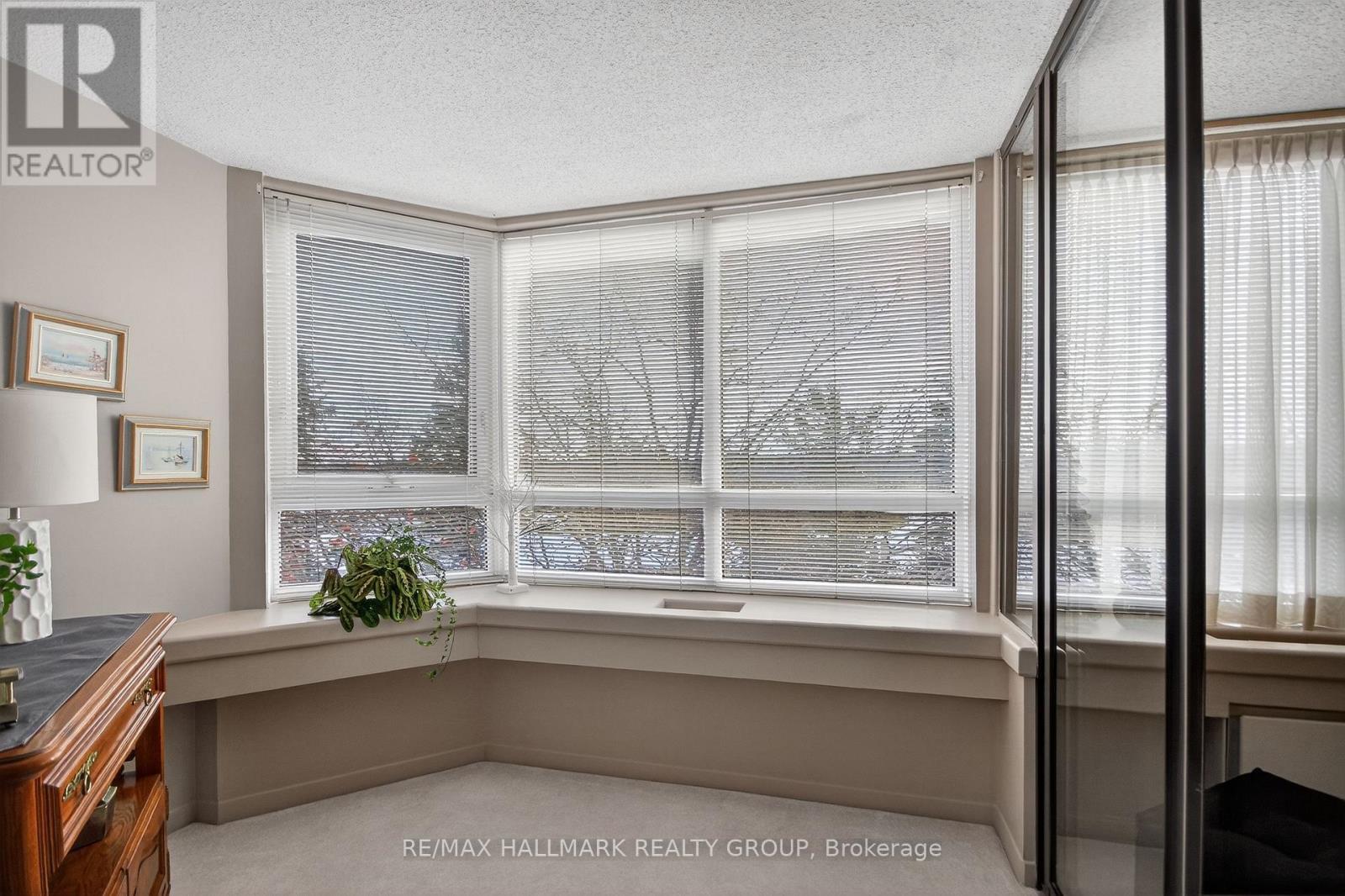 Perfect for coffee, plants, and legendary cat naps - 617 - 80 Sandcastle Drive, Ottawa, ON - Indoor Photo Showing Other Room