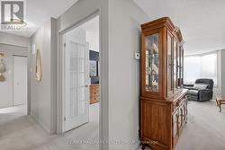 Hallway with powder room, leads to bedrooms -