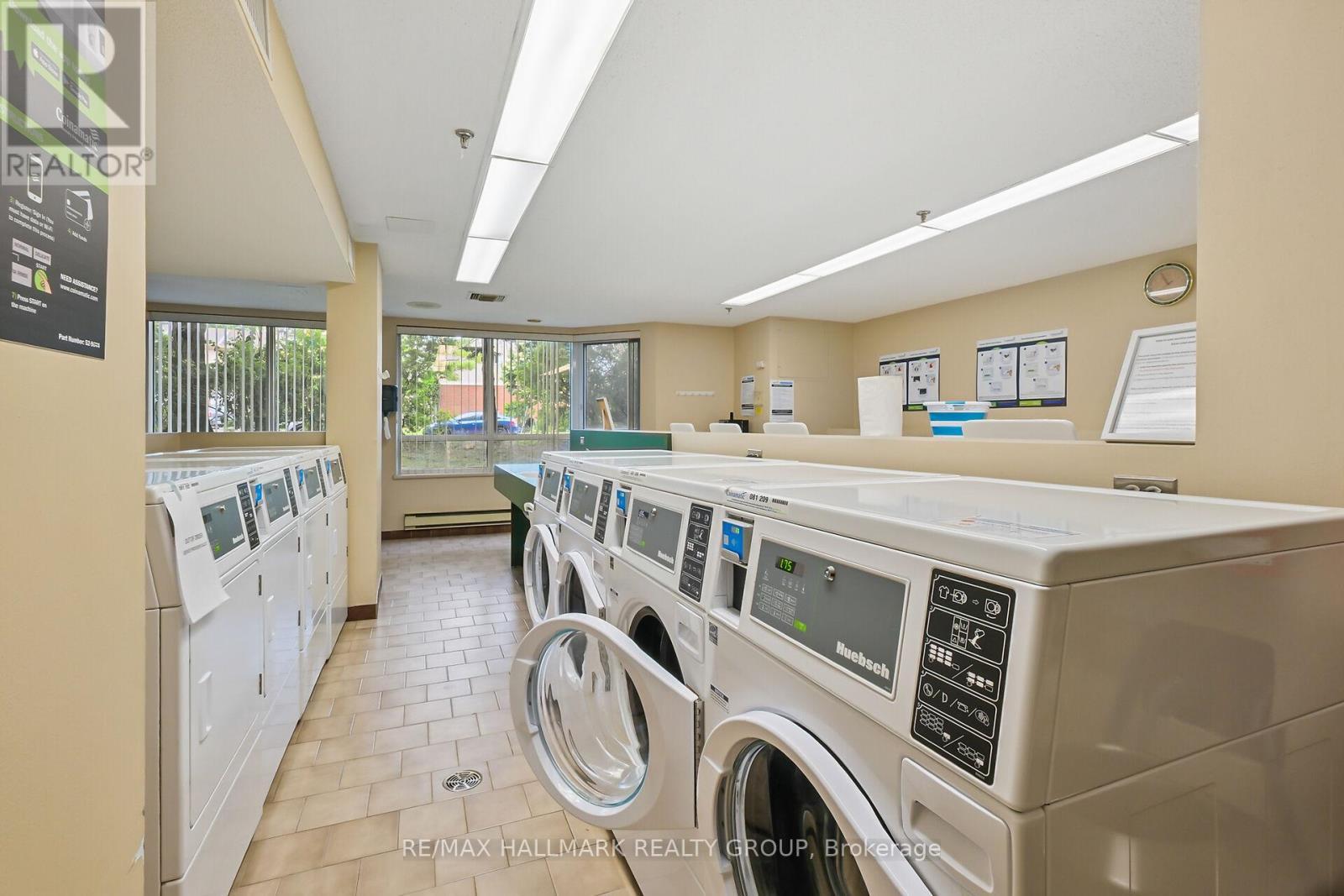 Main Floor Laundry Room, clean + lots machines - 617 - 80 Sandcastle Drive, Ottawa, ON - Indoor Photo Showing Laundry Room