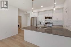 124, 245 Edith Place NW Calgary, AB T3R 2C9