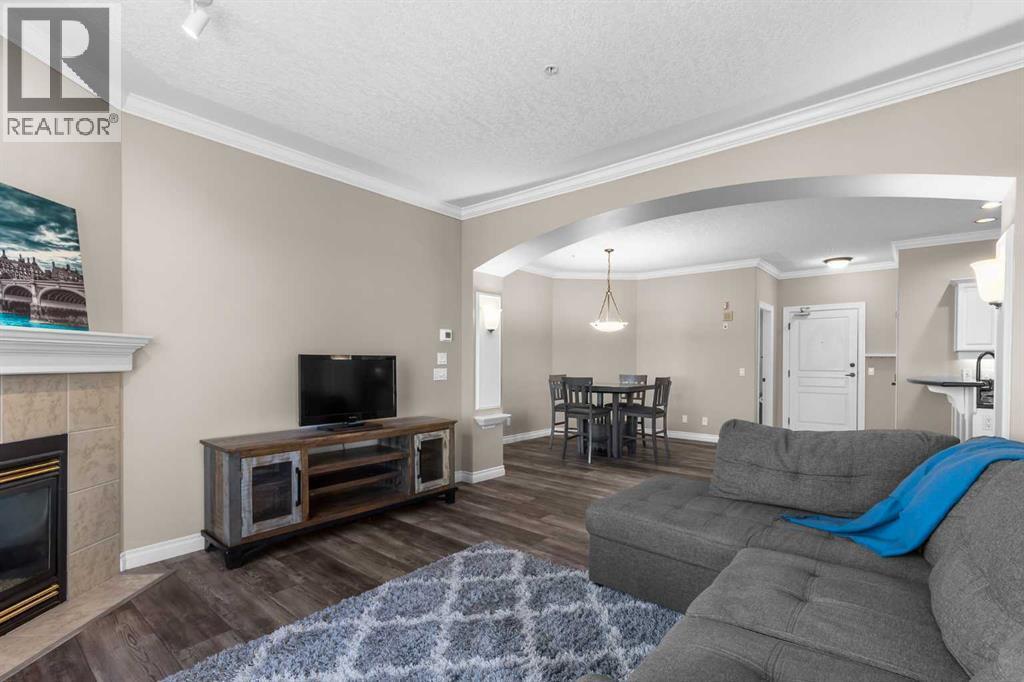 205, 59 22 Avenue Sw, Calgary, AB - Indoor Photo Showing Living Room With Fireplace