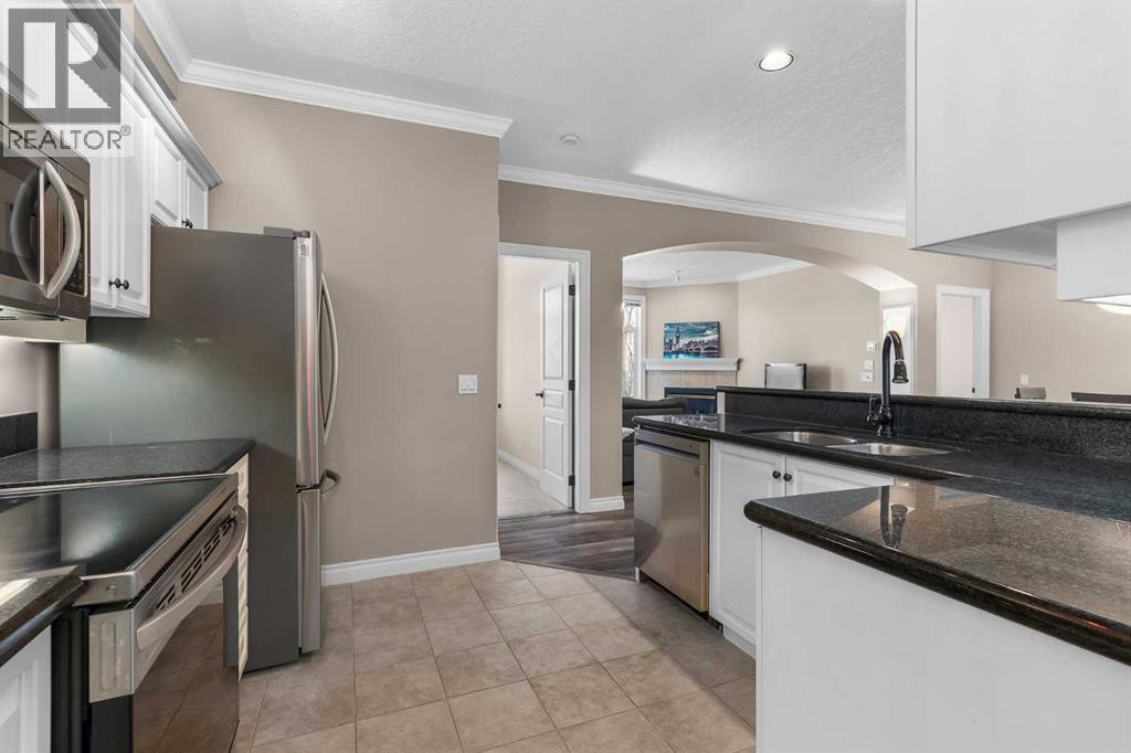 205, 59 22 Avenue Sw, Calgary, AB - Indoor Photo Showing Kitchen With Double Sink