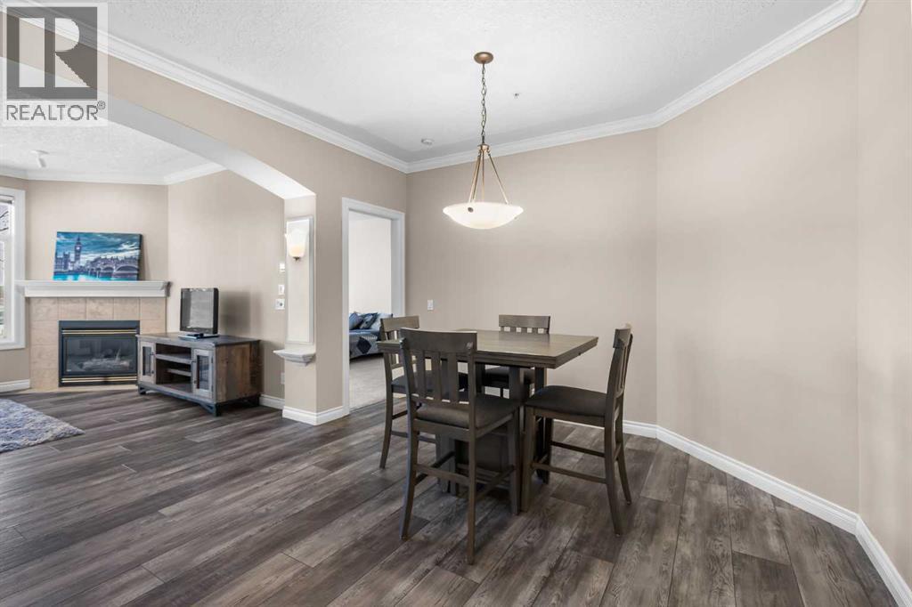 205, 59 22 Avenue Sw, Calgary, AB - Indoor Photo Showing Dining Room With Fireplace